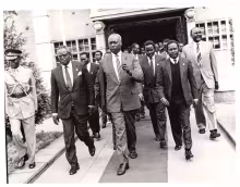 President Daniel Arap Moi leaving Parliament buildings escorted by VP Josphat Karanja after chairing a KANU parliamentary group meeting 
