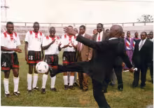 President Daniel Moi entertains footballers and fans with a ball kick during a premier league match between AFC Leopards and Utalii FC at Nyayo Stadium